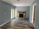 Cozy living room with a stone fireplace and a french door, perfect for relaxation and entertaining guests at 2875 Carriage Ln, Atlanta, GA 30349