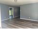 Inviting living room featuring newly installed floors and neutral walls, creating a cozy and modern atmosphere at 2875 Carriage Ln, Atlanta, GA 30349