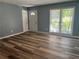 Spacious living room with new floors and large windows, offering a bright and inviting space for gatherings at 2875 Carriage Ln, Atlanta, GA 30349