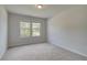 Bright bedroom with large windows and neutral carpet at 68 Homesite Cooper W Cv, Fayetteville, GA 30214