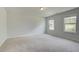 Bright bedroom features neutral walls, plush carpeting and natural light from the windows at 68 Homesite Cooper W Cv, Fayetteville, GA 30214