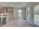 Bright dining area with wood-look flooring and natural light from windows at 68 Homesite Cooper W Cv, Fayetteville, GA 30214