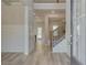 Elegant foyer with beautiful hardwood floors, white trim, and a staircase with wrought iron railings at 68 Homesite Cooper W Cv, Fayetteville, GA 30214