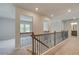 Upstairs hallway with decorative railing at 68 Homesite Cooper W Cv, Fayetteville, GA 30214