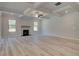 Spacious living room featuring a fireplace, coffered ceilings and wood-look flooring at 68 Homesite Cooper W Cv, Fayetteville, GA 30214
