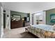 Spacious bedroom with large windows for natural light, light carpet, and green walls at 1421 Peachtree Ne St # 214, Atlanta, GA 30309