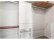 Walk-in closet with custom shelving, drawers and hanging rods at 1421 Peachtree Ne St # 214, Atlanta, GA 30309