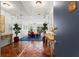 Condo entrance featuring terra cotta tile floors and elegant decor with a glimpse of the living room at 1421 Peachtree Ne St # 214, Atlanta, GA 30309