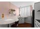 Charming kitchen with a cozy breakfast bar, white countertops, and stainless steel appliances at 1421 Peachtree Ne St # 214, Atlanta, GA 30309
