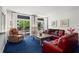 Inviting living room featuring comfortable furniture, large windows, and plenty of space for relaxation at 1421 Peachtree Ne St # 214, Atlanta, GA 30309