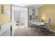 Bright office with built-in cabinets, large desk, and sliding door to a small balcony at 1421 Peachtree Ne St # 214, Atlanta, GA 30309