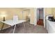 Functional home office featuring a modern desk, mirrored closet, and neutral carpeting at 1421 Peachtree Ne St # 214, Atlanta, GA 30309