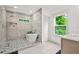 Well-appointed bathroom with a glass-enclosed shower, freestanding tub, and stylish tile accents at 2318 Polar Rock Terrace, Atlanta, GA 30315