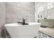 Contemporary bathroom featuring a freestanding tub, sleek tiling, and dual vanities for a spa-like experience at 2318 Polar Rock Terrace, Atlanta, GA 30315
