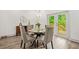 Light-filled dining area with access to outdoor deck and a round table at 2318 Polar Rock Terrace, Atlanta, GA 30315