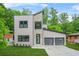 Modern two-story home with stone accents, two-car garage, and stylish curb appeal at 2318 Polar Rock Terrace, Atlanta, GA 30315