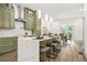 Modern kitchen with stainless steel appliances, large island, breakfast bar, and marble backsplash at 2318 Polar Rock Terrace, Atlanta, GA 30315