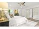 Bright main bedroom with modern finishes, barn door to en suite bathroom, and a soothing, neutral color palette at 2318 Polar Rock Terrace, Atlanta, GA 30315
