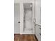Shower with clear glass, and marble tiling in a modern bathroom design at 110 3Rd St, Fayetteville, GA 30214