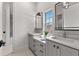 Bright bathroom with double vanity, modern fixtures, and a view from the window at 110 3Rd St, Fayetteville, GA 30214