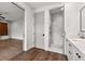 Elegant bathroom boasts a glass-enclosed shower with marble tiling and wood floors at 110 3Rd St, Fayetteville, GA 30214