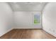 Empty room with hardwood floors, window, and ample natural light at 110 3Rd St, Fayetteville, GA 30214