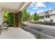 Cozy front porch with comfortable seating, lattice detailing, and a view of the quiet street, perfect for relaxing at 110 3Rd St, Fayetteville, GA 30214