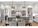 Modern kitchen with a large island, stainless steel appliances, and dining area at 110 3Rd St, Fayetteville, GA 30214