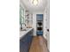 Butler's pantry featuring blue cabinets, stainless steel appliances, and floating glass shelves at 110 3Rd St, Fayetteville, GA 30214