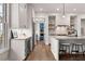 Kitchen featuring stainless steel appliances, an island with seating, and hardwood floors at 110 3Rd St, Fayetteville, GA 30214