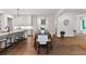 Bright kitchen and dining area with an expansive island and hardwood flooring at 110 3Rd St, Fayetteville, GA 30214