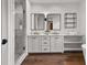 Elegant main bathroom with double vanity, large soaking tub, and glass-enclosed shower at 110 3Rd St, Fayetteville, GA 30214