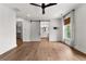 Main bedroom featuring hardwood floors, sliding door to the Primary bath and walk-in closet at 110 3Rd St, Fayetteville, GA 30214
