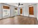 Spacious main bedroom with three large windows providing natural light and hardwood floors at 110 3Rd St, Fayetteville, GA 30214
