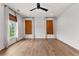 Bright and airy main bedroom featuring hardwood floors and natural window coverings at 110 3Rd St, Fayetteville, GA 30214