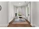 Bright office with a white desk, leather chair, a gray rug, and lots of natural light at 110 3Rd St, Fayetteville, GA 30214