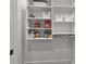 Well-organized pantry with white shelves and storage bins for optimal organization at 110 3Rd St, Fayetteville, GA 30214