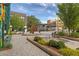 Charming commercial district featuring decorative water features, landscaping, and store fronts at 110 3Rd St, Fayetteville, GA 30214