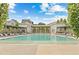 Luxury community pool with lounge chairs and shaded pergola areas under a sunny sky at 110 3Rd St, Fayetteville, GA 30214