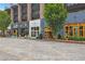 Commercial street view featuring stylish store fronts, landscaping, and brick paving at 110 3Rd St, Fayetteville, GA 30214