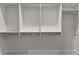 Organized walk-in closet with multiple levels of shelving and hanging rods at 110 3Rd St, Fayetteville, GA 30214