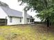 The backyard features a fence, a patio, and a lush lawn at 1255 Summit Point Ln, Snellville, GA 30078