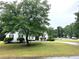 Charming home with mature trees and a well manicured front yard at 1255 Summit Point Ln, Snellville, GA 30078