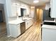 Updated kitchen featuring stainless steel appliances, white cabinets, and modern fixtures at 1255 Summit Point Ln, Snellville, GA 30078