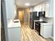 Modern kitchen with stainless steel appliances, white cabinets, and subway tile backsplash at 1255 Summit Point Ln, Snellville, GA 30078
