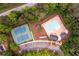 Aerial view of the community pool, tennis courts, and playground, surrounded by lush greenery at 2759 Beddington Way, Suwanee, GA 30024