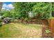 Spacious backyard featuring a patio with outdoor seating and well-maintained landscaping at 2759 Beddington Way, Suwanee, GA 30024
