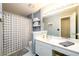 Bathroom with a large mirror, vanity, and shower with curtain at 2759 Beddington Way, Suwanee, GA 30024