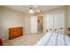 Well-lit secondary bedroom features a dresser, carpet, and closet space at 2759 Beddington Way, Suwanee, GA 30024