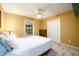 Cozy bedroom showcasing carpeted floors, a ceiling fan, and a closet at 2759 Beddington Way, Suwanee, GA 30024